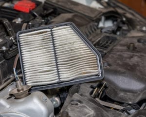 Dirty air filter for car engine. Concept of automobile maintenance and service