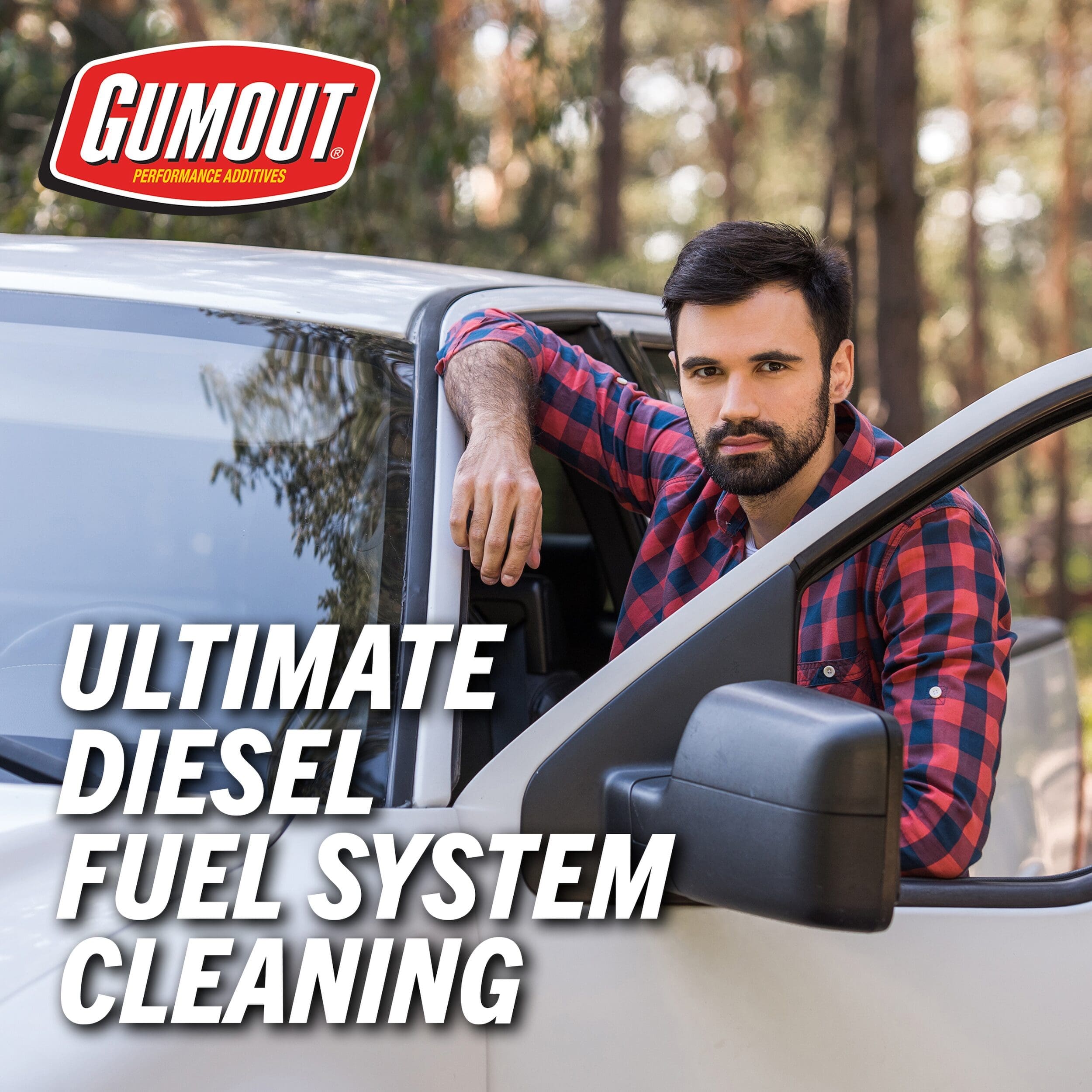 Advertisement image: man leaning from a car window with a bold headline 'ULTIMATE DIESEL FUEL SYSTEM CLEANING' and Gum Out logo in a wooded outdoor setting.